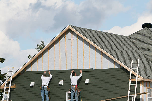 Professional Storm Damage Siding Repair technician working in Oakdale, MN